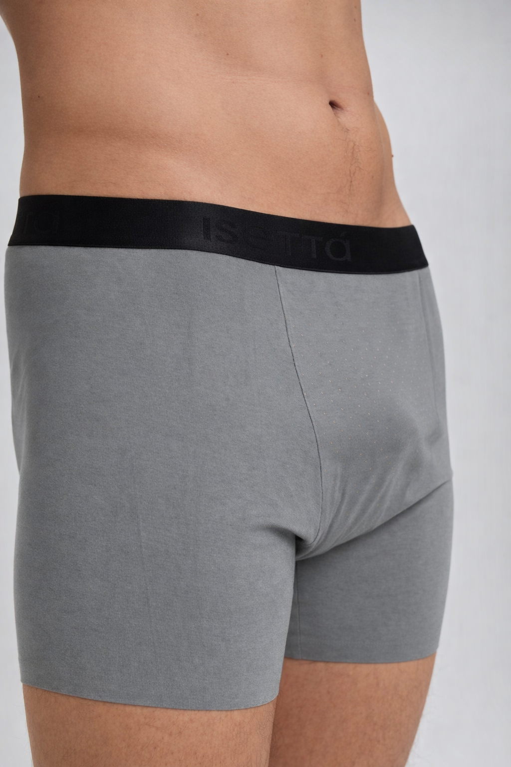 Gray boxer briefs with black waistband on a plain background