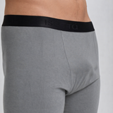 Gray boxer briefs with black waistband on a plain background
