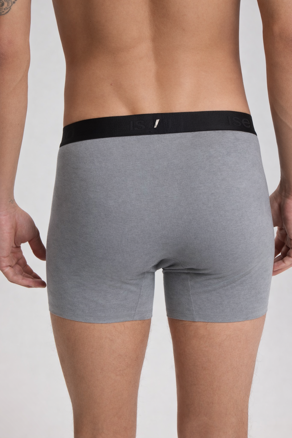 Gray boxer briefs with black waistband on a plain background