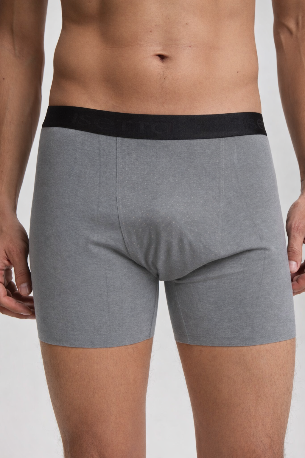 Gray boxer briefs with a black waistband on a plain background