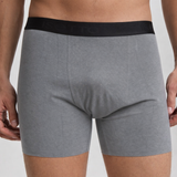 Gray boxer briefs with a black waistband on a plain background