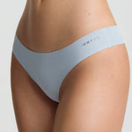 Light blue underwear set on a neutral background