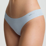 Light blue underwear set on a neutral background