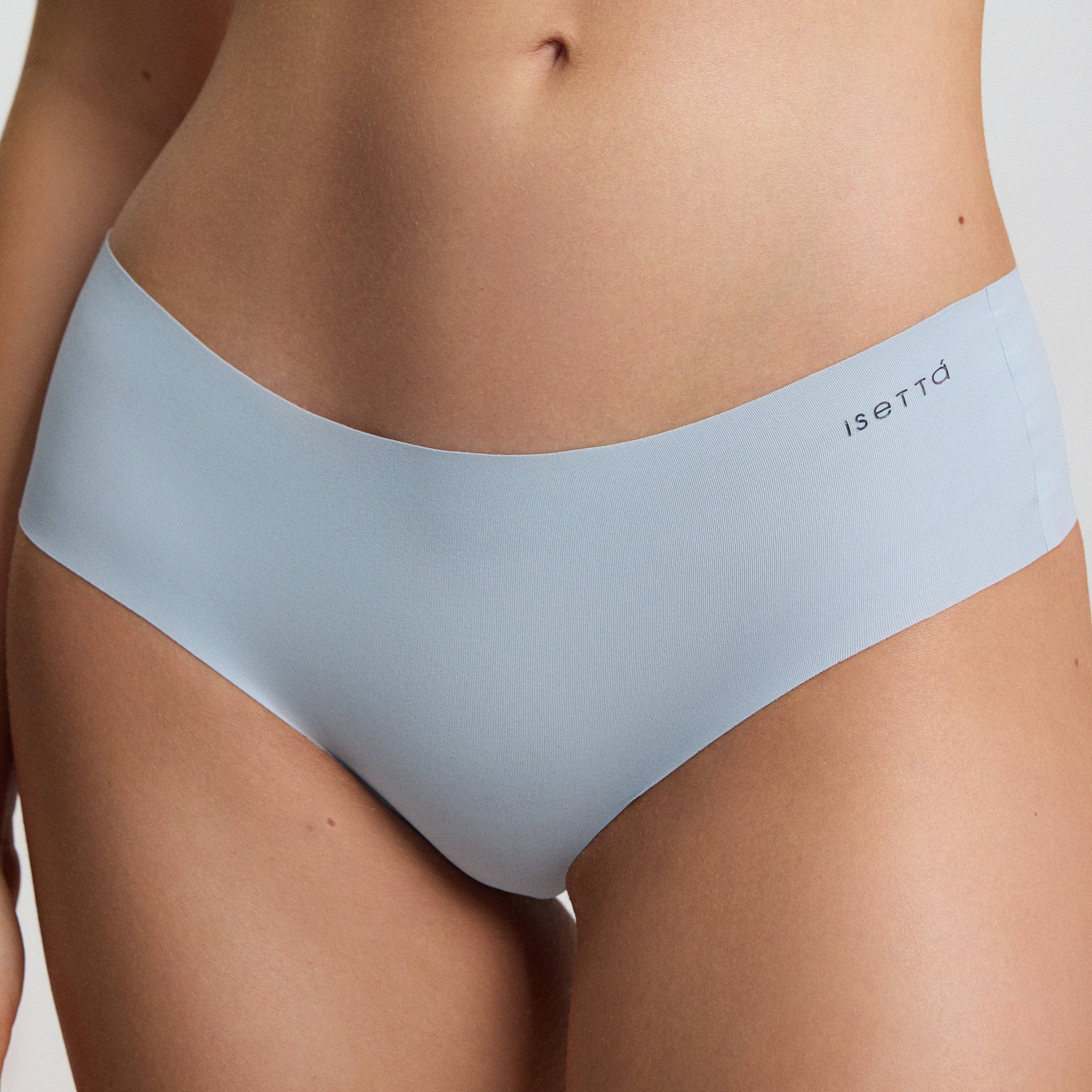Light blue athletic top and underwear set with 'sette' branding on a neutral background