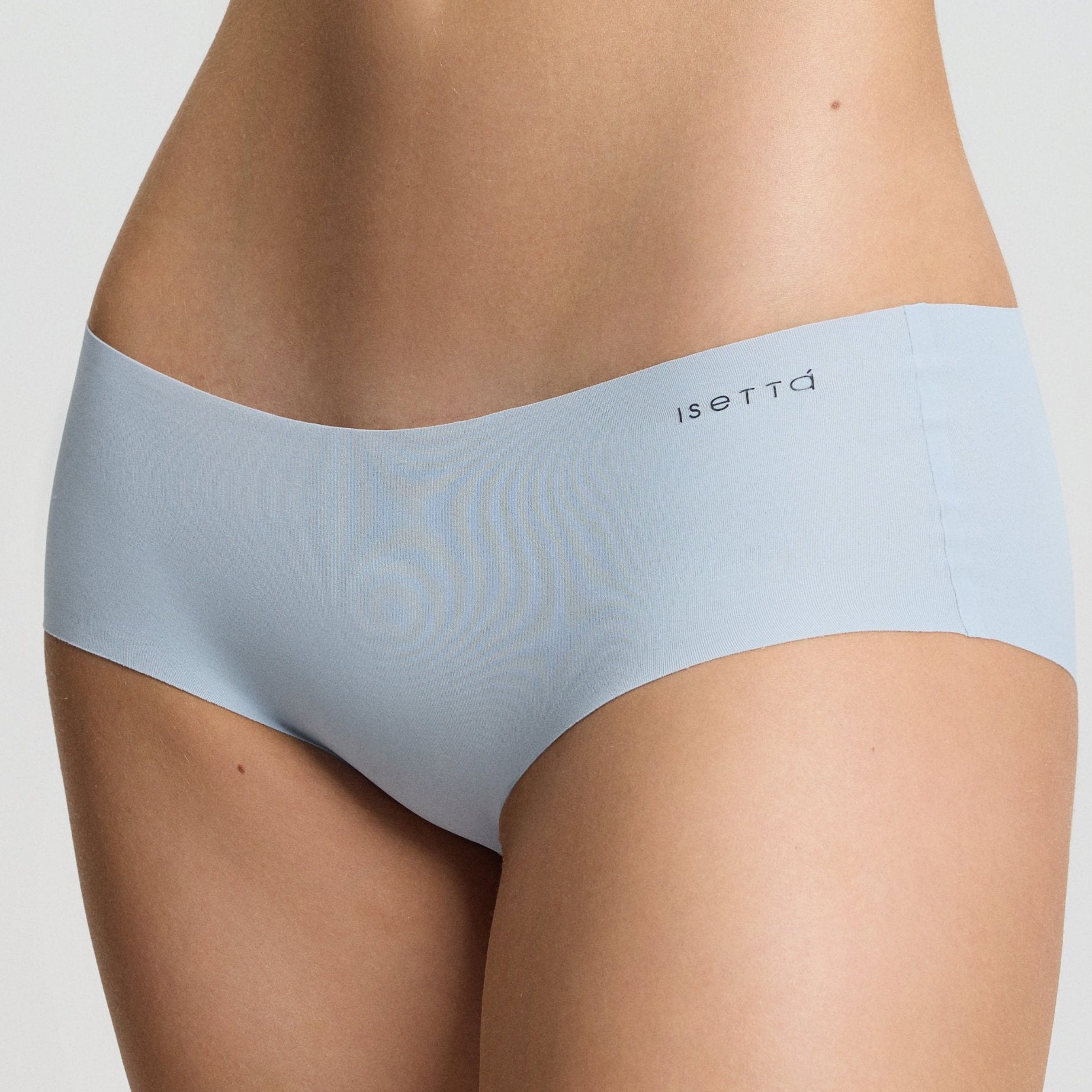 Light blue sports bra and underwear set on a neutral background