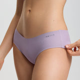 Person wearing a pair of lavender underwear on a plain background