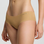Beige high-waisted underwear on a plain background