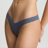 Person wearing a gray bikini set on a plain background