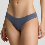 Person wearing a gray bikini set on a white background